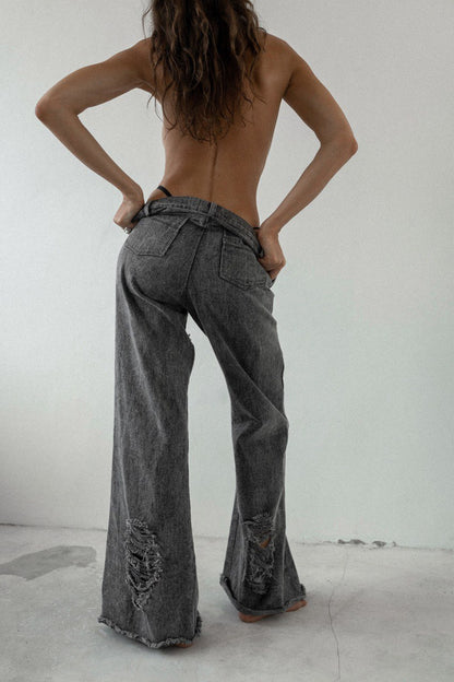 Stonewashed denim jeans with holes