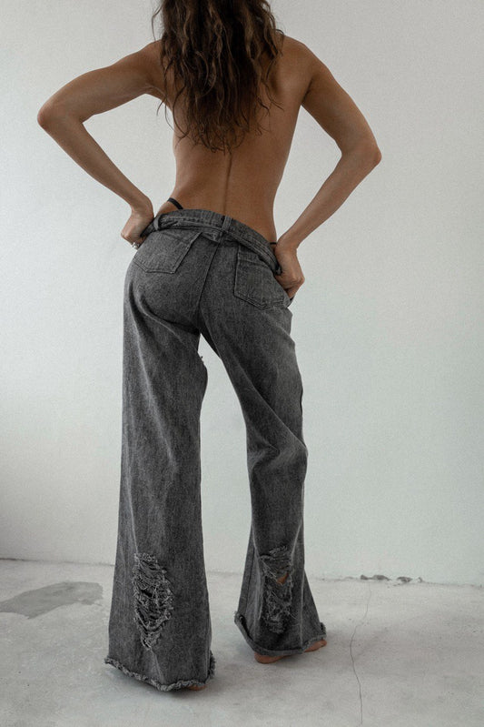 Stonewashed denim jeans with holes
